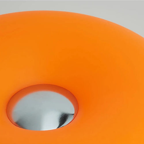 Orange light fixture on a gray background